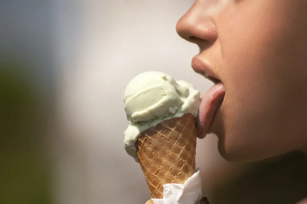 Woman Licking Ice Cream